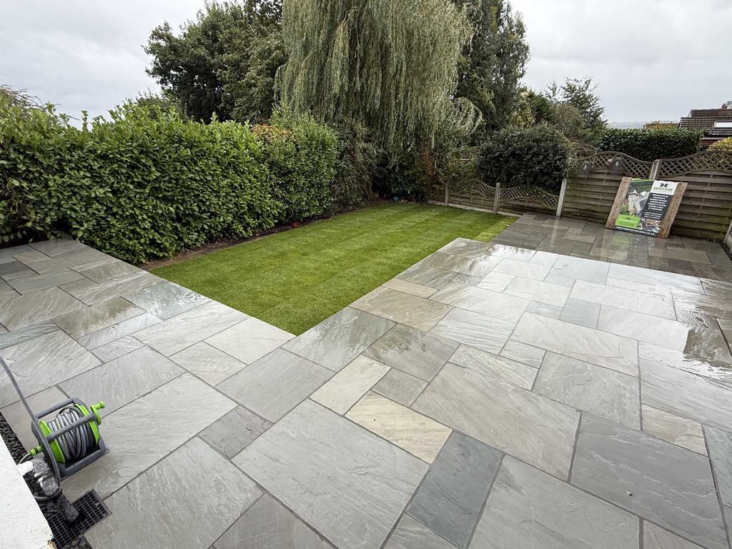 Kandla Grey Indian sandstone paving surrounding freshly laid turf in Horsforth