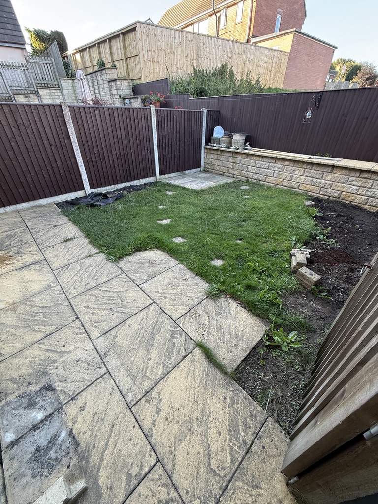 Before: old slabs and lawn in Drighlington