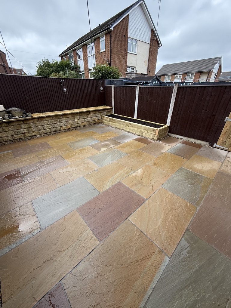 Small Indian sandstone patio and timber planter completed in Drighlington
