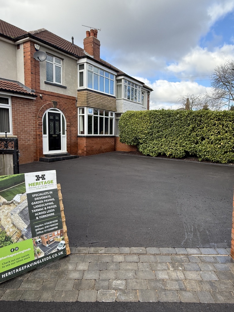 Finished tarmac driveway with Heritage sign and house frontage