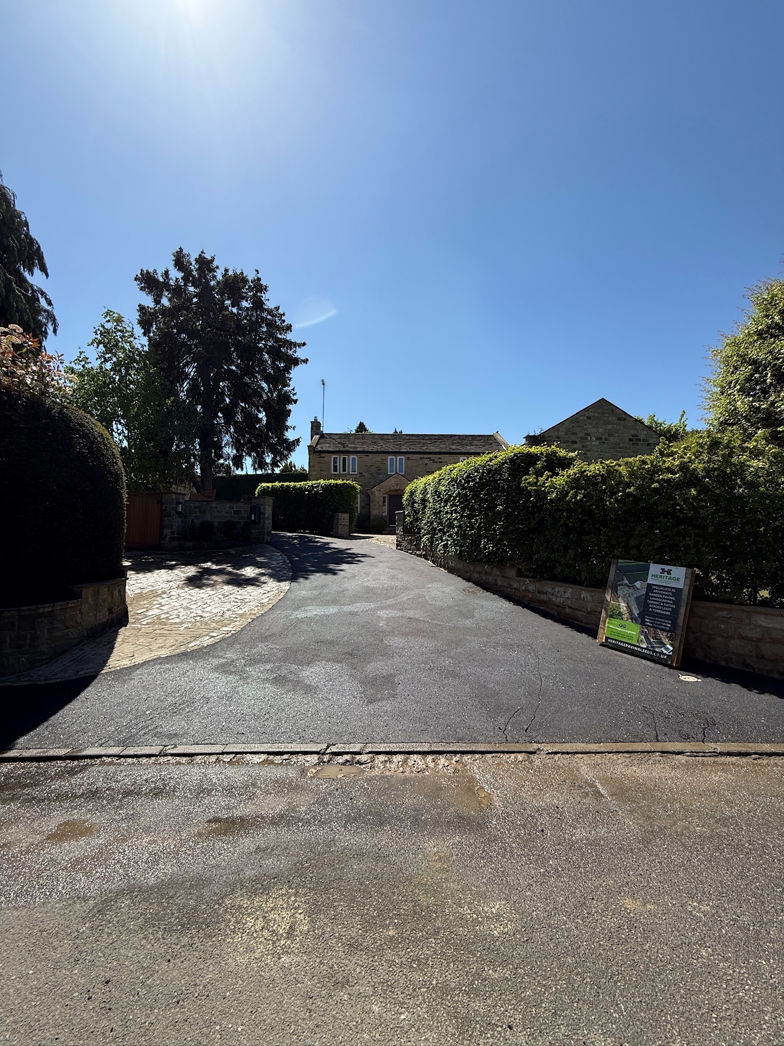 Finished tarmac lane and entrance viewed from the road in Linton