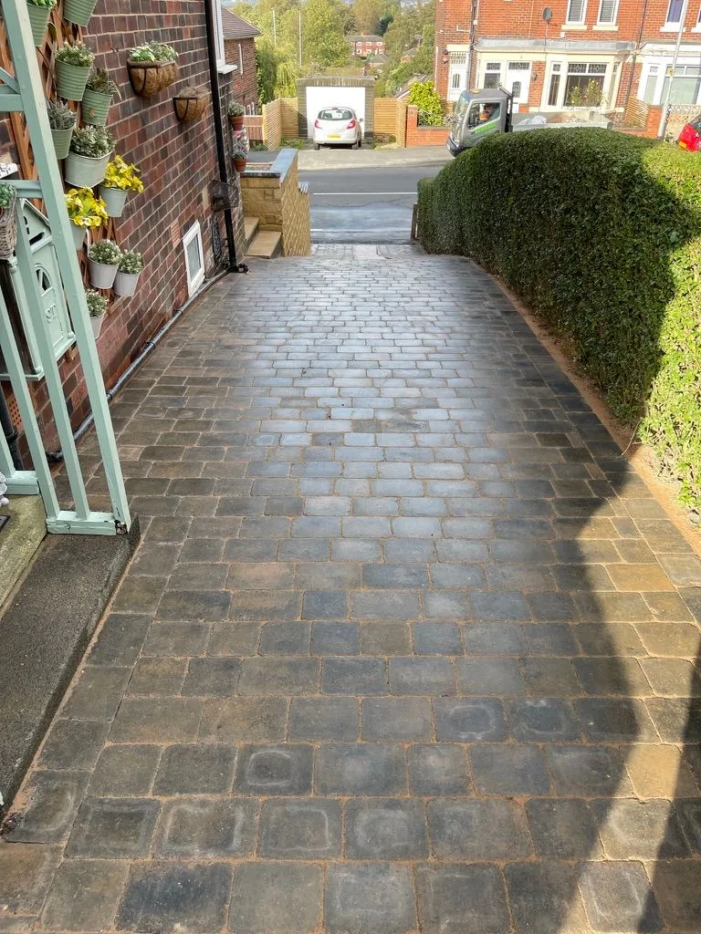 Tumbled block paving along a sloping side drive