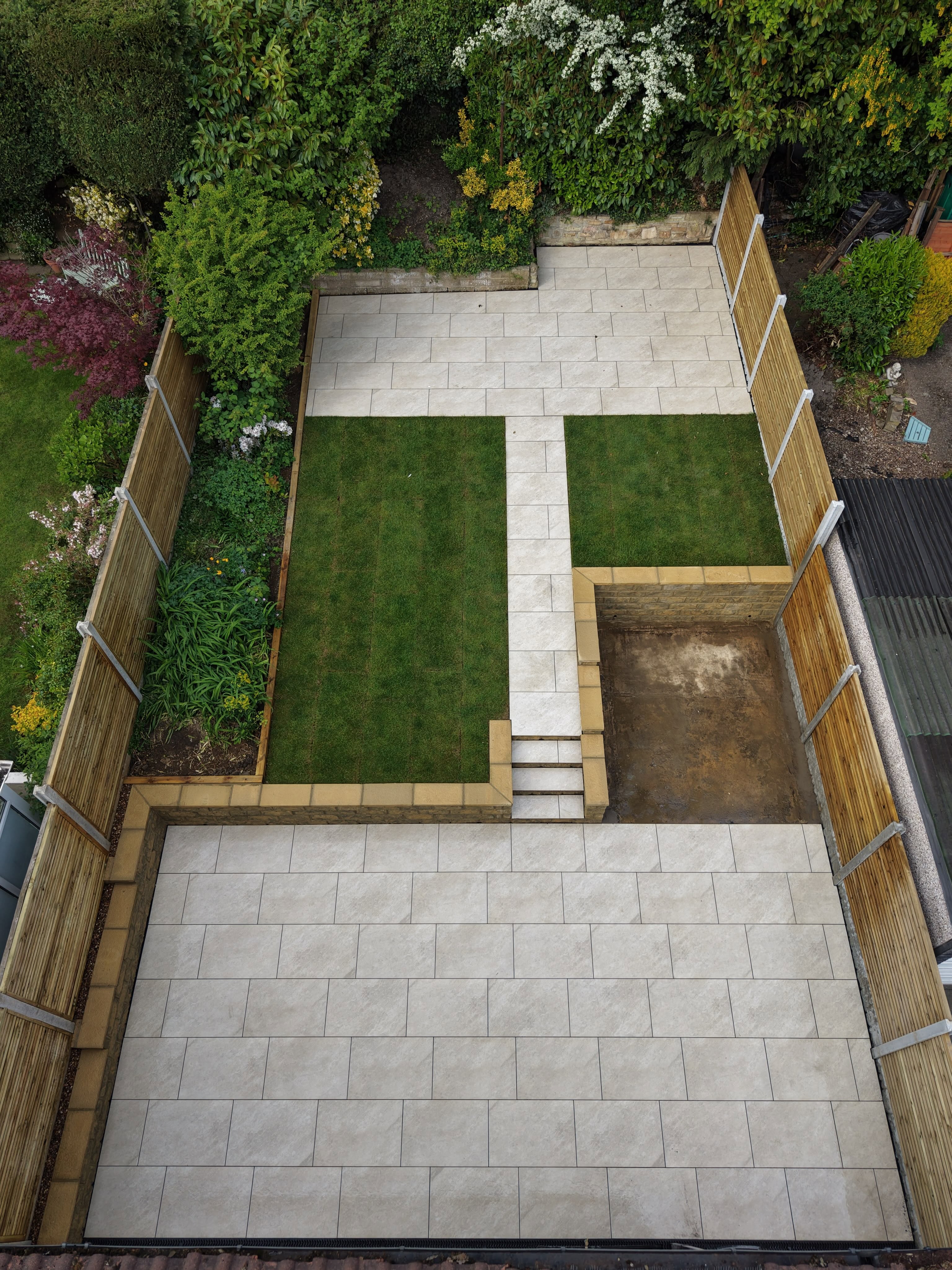 Completed patio, lawn and fencing viewed from above — Leeds