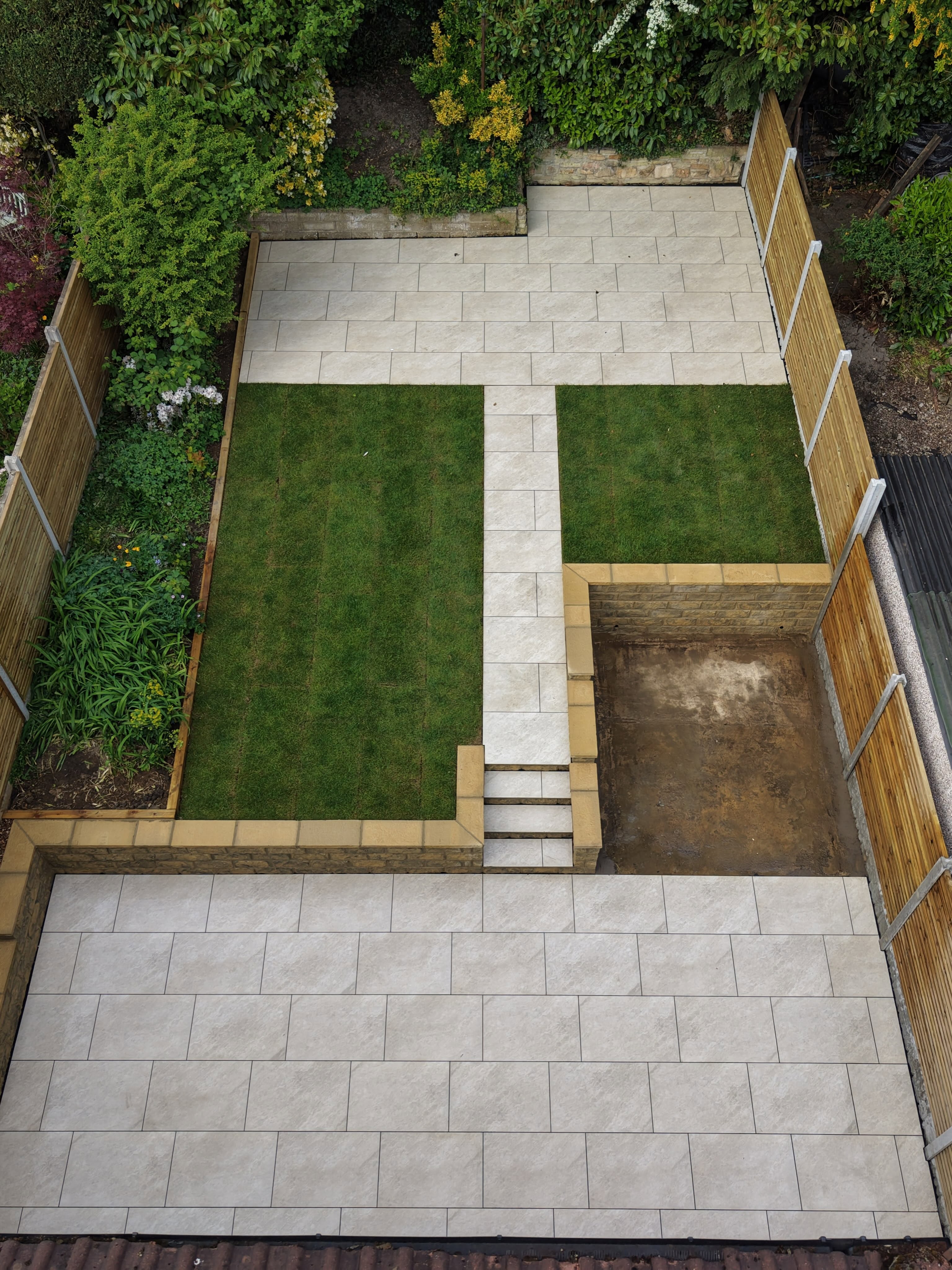 Finished garden layout with paving, turf and fencing — Leeds