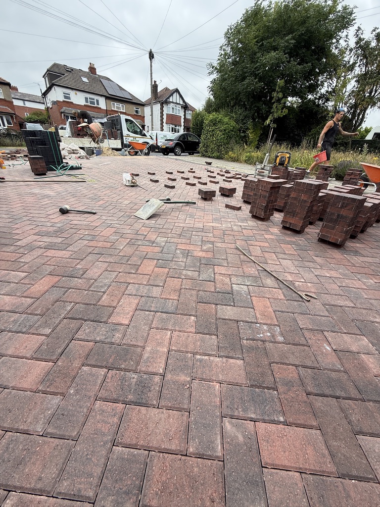 Brindle herringbone paving during installation.