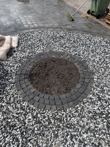Planters and curved borders by Heritage Paving and Landscaping